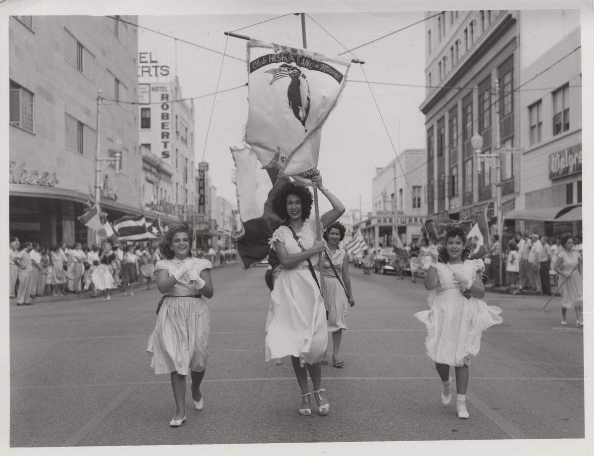 7/10/1953: Parade on West Flagler Street. Magdalena Torres, Evelyn Lopez and Lillian Acosta march.