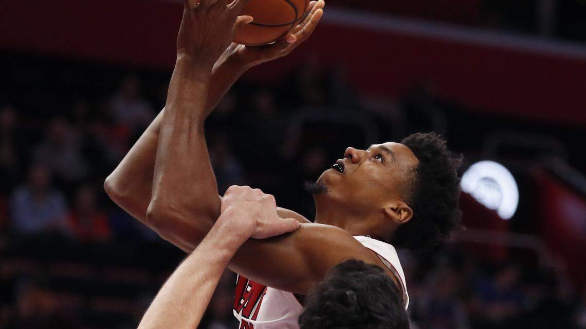 Miami Heat center Hassan Whiteside (21) is fouled by Detroit Pistons center Zaza Pachulia (27) during the second half of an NBA basketball game, Friday, Jan. 18, 2019, in Detroit. (AP Photo/Carlos Osorio)
