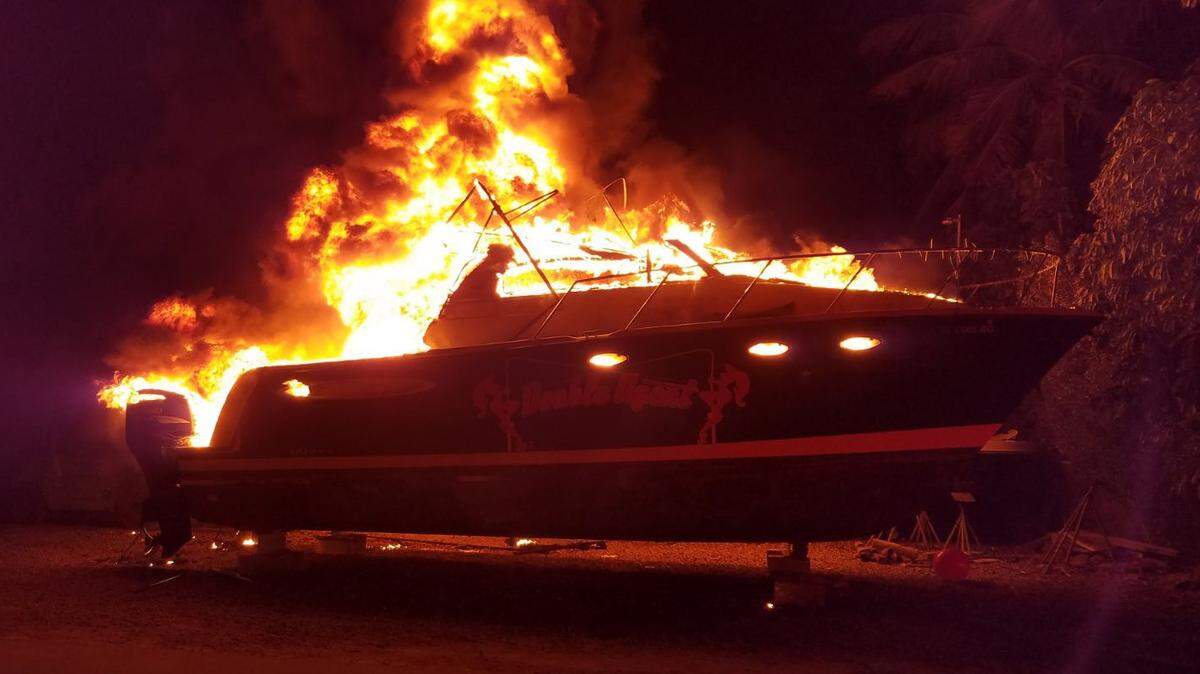 The ‘Double Agent,’ a charter fishing boat based in Islamorada, is covered in flames Monday morning, Feb. 11, 2019, at the Coral Bay Marina in Upper Matecumbe Key. Police suspect arson and insurance fraud were behind the blaze that also destroyed another vessel and burned one more.