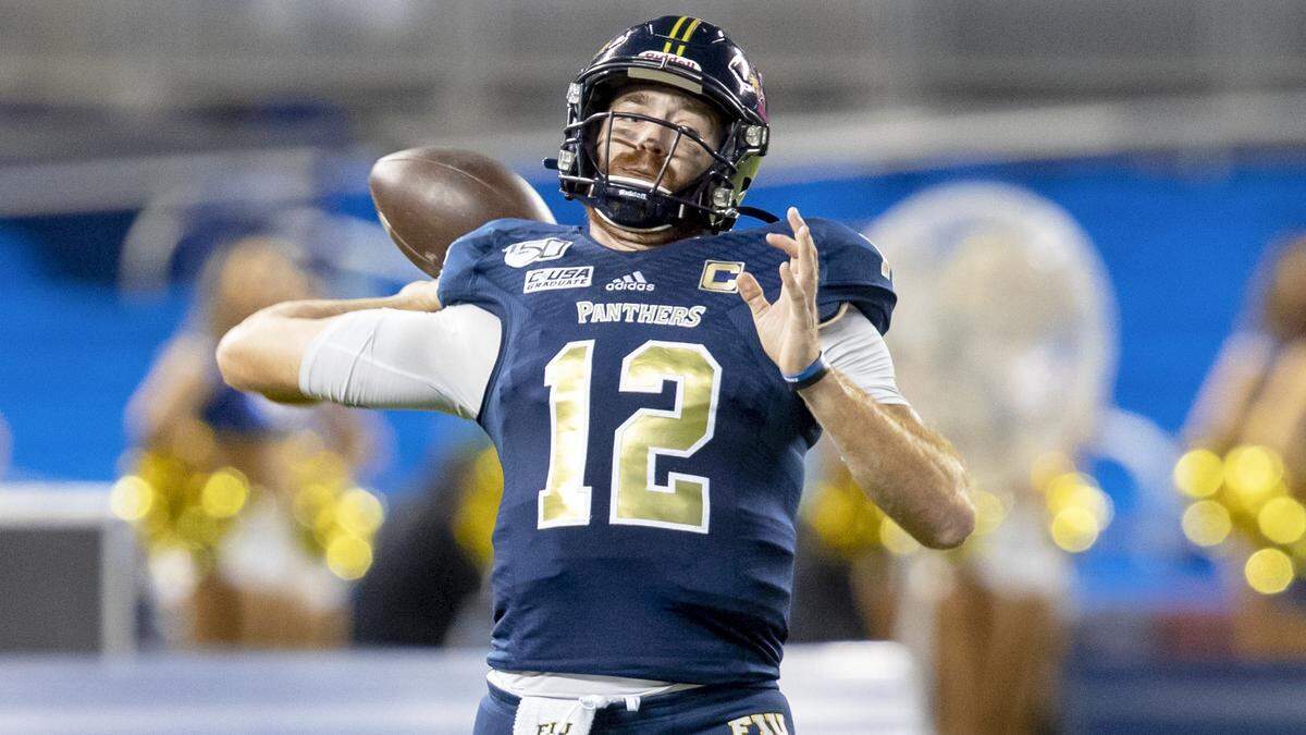 FIU quarterback James Morgan (12) throws the ball during the first quarter of a football game against University of Miami at Marlins Park in Miami, Florida on Saturday, Nov. 23, 2019.