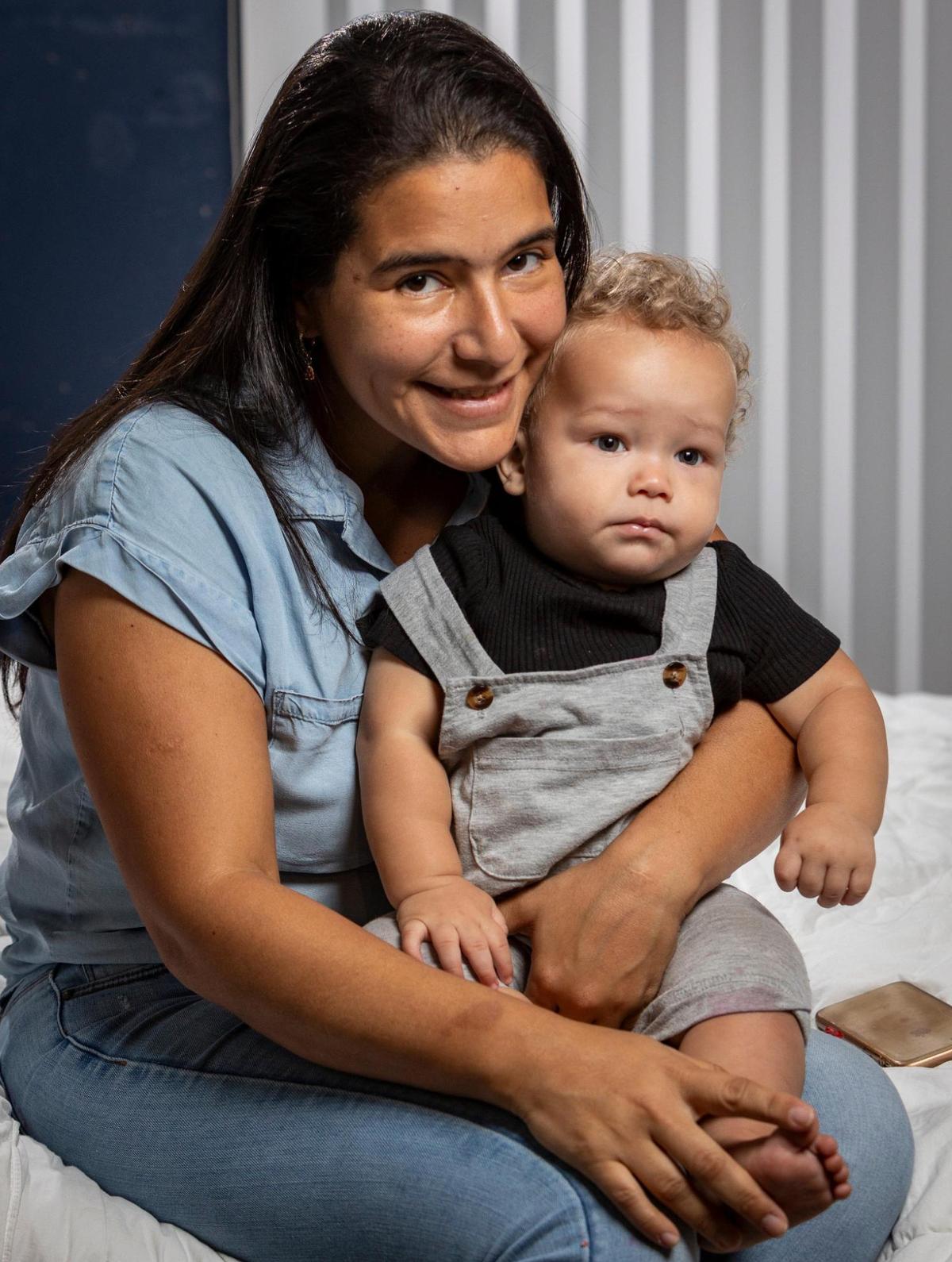 Kimberly Lanz, 35, takes her baby, Jake Azocar, to work with her so she can avoid paying $1,000 a month for daycare.