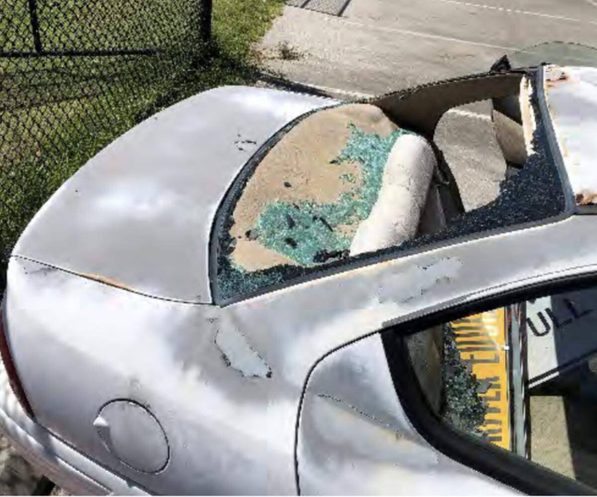 The back window of a Miami-Dade County Public Schools driver education program car is smashed out.