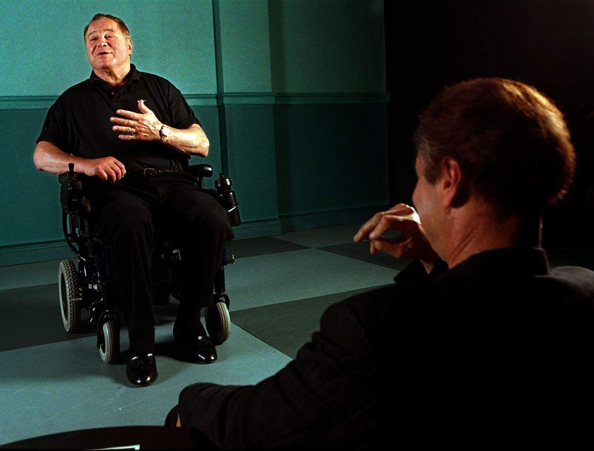 Art Metrano, who was injured in an accident that left him partially paralyzed, delivered part of his monologue from his Coconut Grove Playhouse production of his one-man show, “Metrano’s Accidental Comedy,” in this Nov. 7, 2001, file photo. Director Joseph Bologna is on the right.