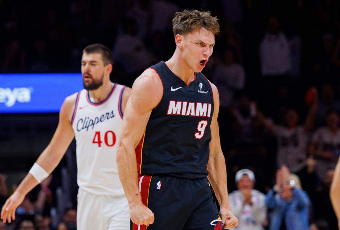Miami Heat guard Pelle Larsson (9) reacts to assisting Miami Heat guard Terry Rozier (2) in a three pointer during the first half of a game on March 12, 2025, at the Kaseya Center in Miami.