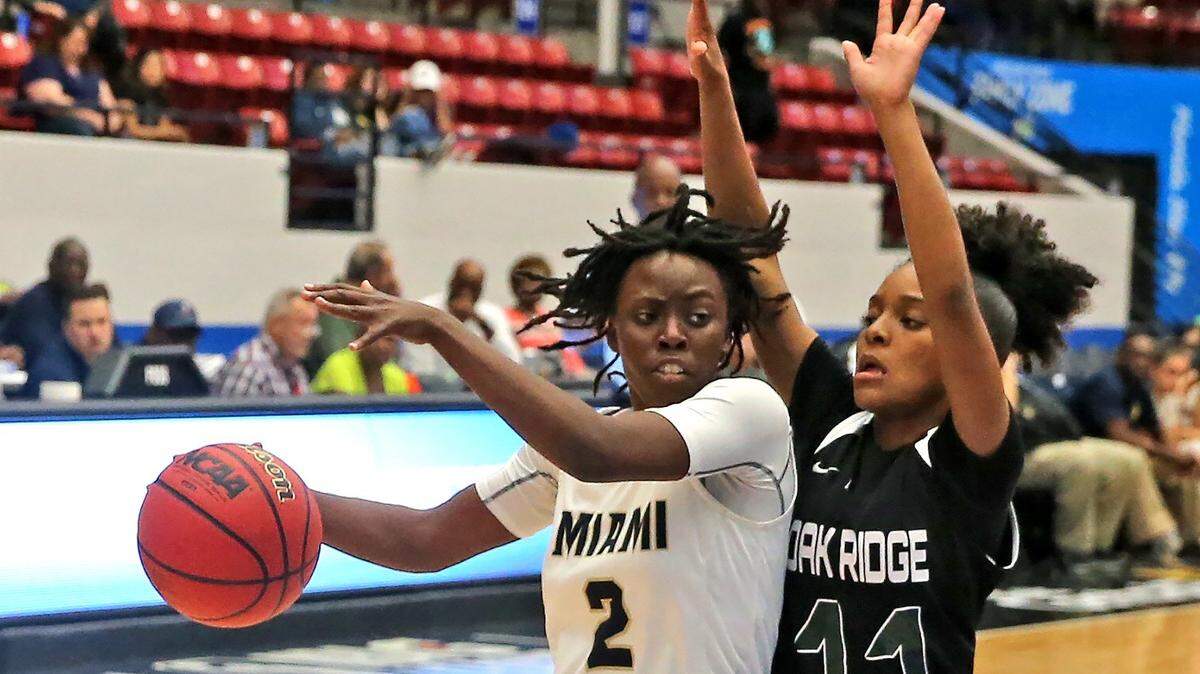 Miami HS Jeanine Scott (2) is guarded by Oak Ridge HS Jhenaah Lawson (11) in the 9A Semi-Finals Girl’s State Basketball Championships at the RP Funding Center in Lakeland, Florida, Friday, March, 1, 2019.