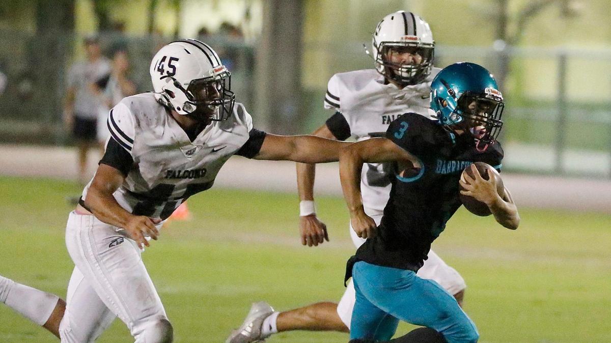Coral Reef Barracudas wide receiver Nathan Miranda (3) tries to break free from Ferguson Falcons defenders during the GMAC Independent Conference title football game on Thursday, November 14, 2024 at Southridge HS in Miami.