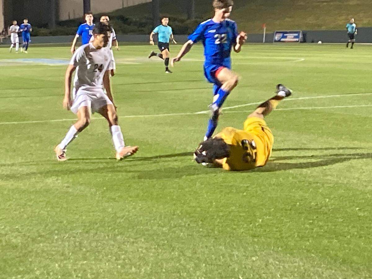 Pembroke Pines Charter goalkeeper Massimo Lopez-Malo smothers a shot during Tuesday night’s Class 5A boys soccer state semifinal at Spec Martin Stadium in DeLand, Fla.