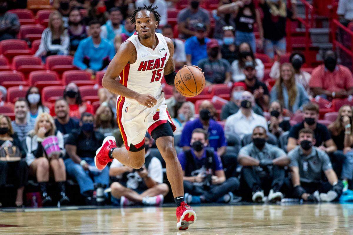 Miami Heat guard Javonte Smart (15) takes the ball down court during the fourth quarter of an NBA preseason game against the Charlotte Hornets at FTX Arena in Miami on October 11, 2021.