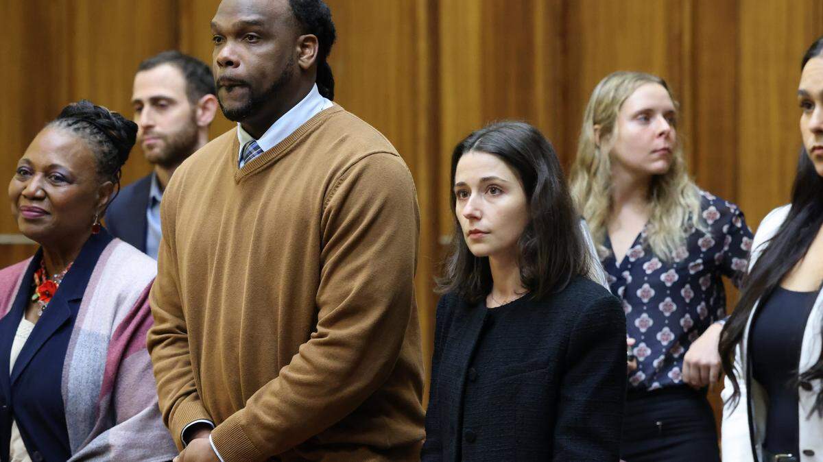 Rashaun Jones, who is accused of killing his University of Miami football teammate Bryan Pata in 2006, stands with defense attorneys in Judge Cristina Miranda’s courtroom at the Richard E. Gerstein Justice Building in Miami on Monday, March 2, 2026.