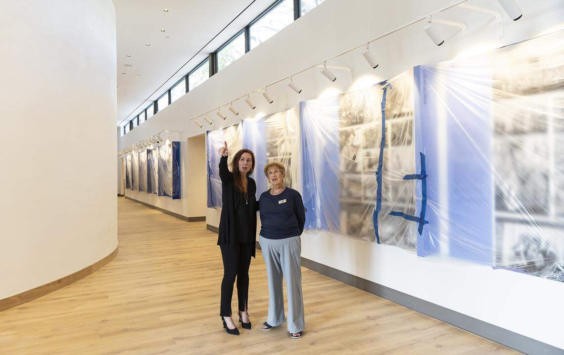 Sheri Zvi, chief executive officer of the Holocaust Memorial Miami Beach, left, gives Holocaust survivor Rodi Glass, 90, a tour of the newly constructed Education Center on Friday, Jan. 23, 2026, in Miami Beach, Fla. The Education Center is set to open to the public in early 2026 and will feature space dedicated to preserving Holocaust memory through survivor testimony, digital storytelling and immersive learning.
