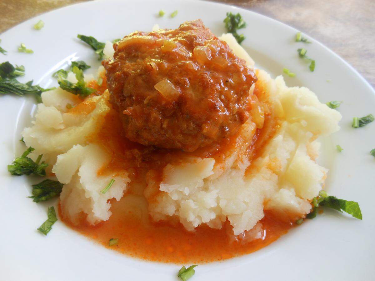 Shirin Glatt's Giant chicken meatball in tomato sauce on mashed potatoes.  