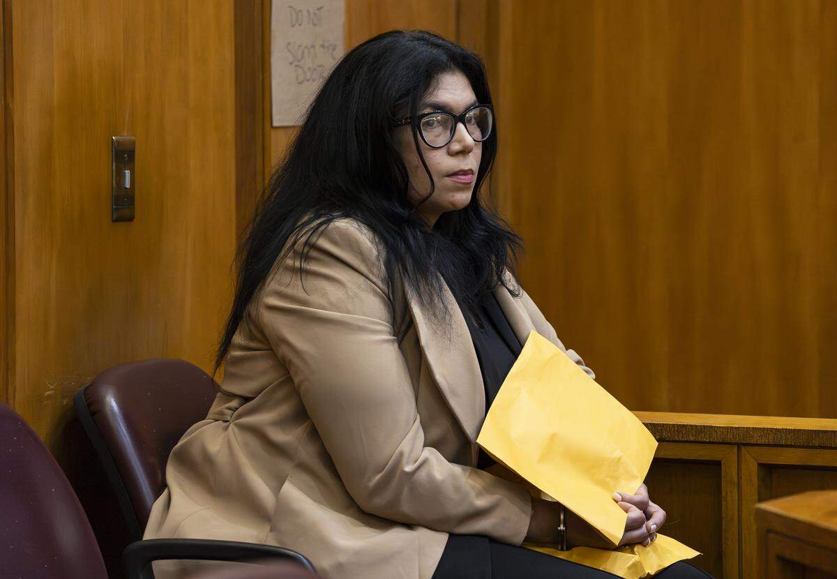 Former Miami-Dade School Board member Lubby Navarro is handcuffed during her plea hearing at the Richard E. Gerstein Justice Building on Tuesday, April 14, 2026, in Miami, Fla. Navarro plead guilty to spending up to $100,000 of district funds while in office.