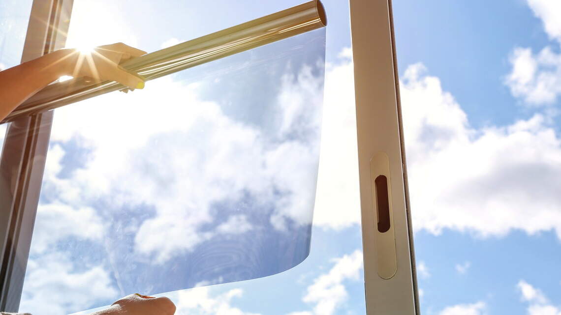 Static-cling cooling films are turning ordinary windows into shields against extreme summer heat indoors