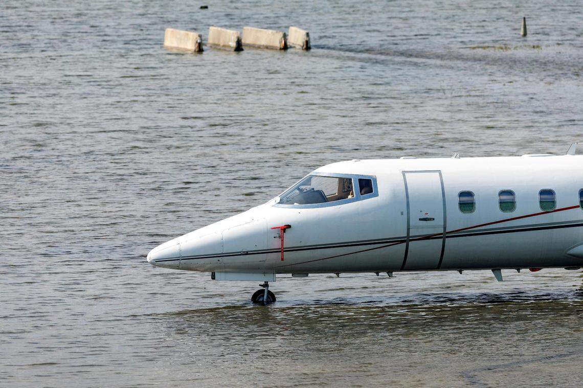 A private jet charter next to the hangar as the runway remains flooded from heavy rain at Fort Lauderdale-Hollywood International Airport in April 2023.