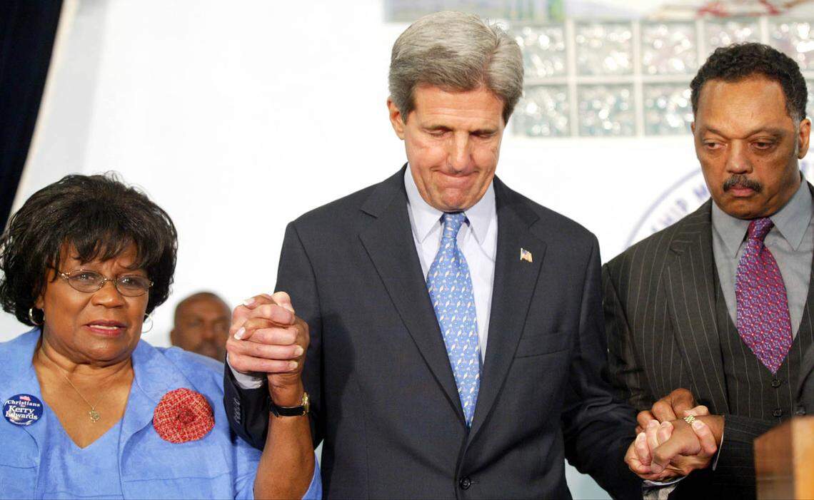 In 2004, former Congresswoman Carrie Meek (left), Sen. Kerry and Rev. Jesse Jackson (right), prayed together. John Kerry attended a service at the 75-year-old Friendship Missionary Baptist Church in Miami, Florida as he made several appearances in the Miami-Dade area.