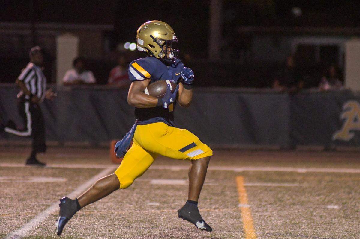 St. Thomas Aquinas running back Xavier Terrell runs for a touchdown in a Region 3-3M quarterfinal game against Coconut Creek on Friday, Nov. 11, 2022, at St. Thomas Aquinas High School in Fort Lauderdale, Florida.