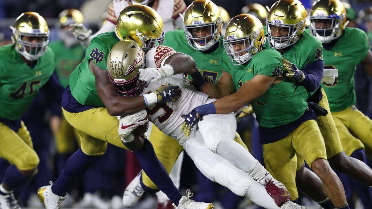 Florida State running back Jacques Patrick (9) is brought down by the Notre Dame defense in the second half of an NCAA college football game in South Bend, Ind., Saturday, Nov. 10, 2018. (AP Photo/Paul Sancya)