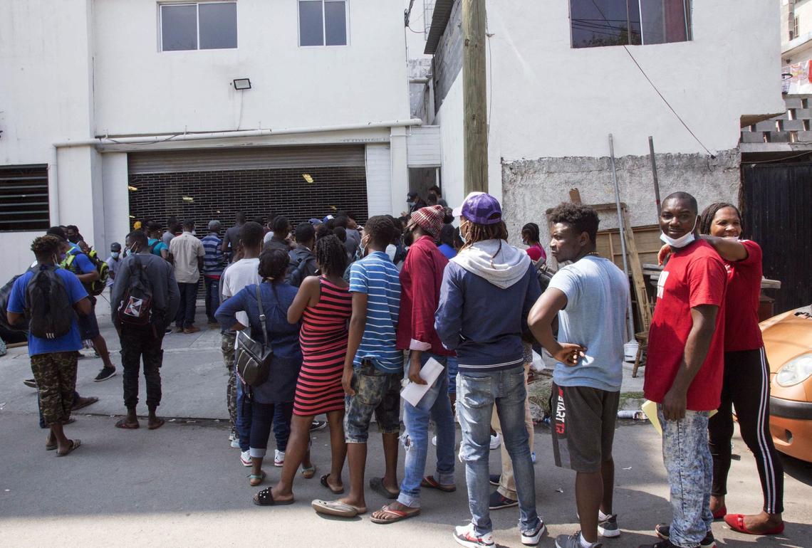 Haitian migrants wait to enter the National Commission for Refugees offices to ask for asylum in Monterrey, Mexico, on Sept. 27, 2021.