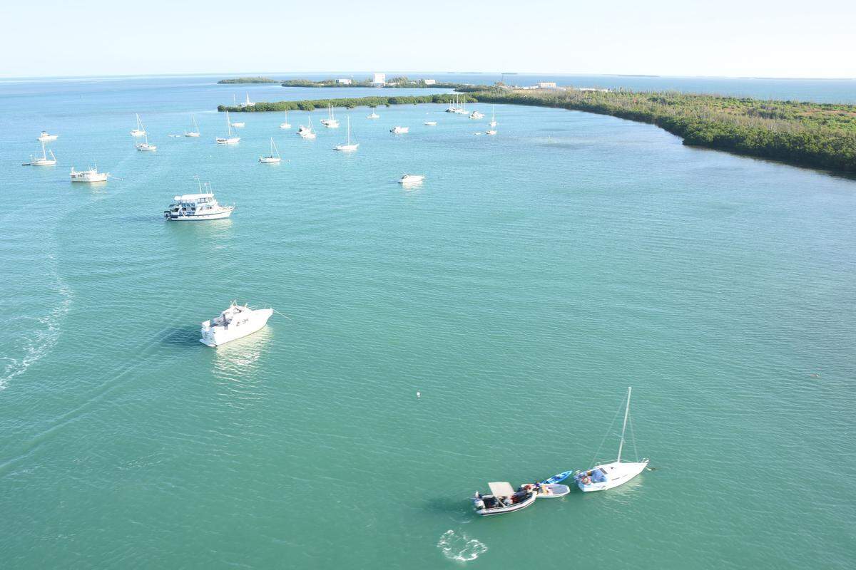 On Friday, the Navy’s security forces and other law enforcement agencies ticketed boats anchored in the restricted waters off Fleming Key near Key West.