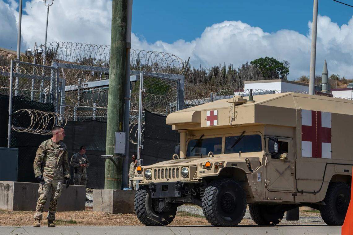 U.S. service members stand by during an April simulated medical evacuation of immigrants detained at Guantánamo.