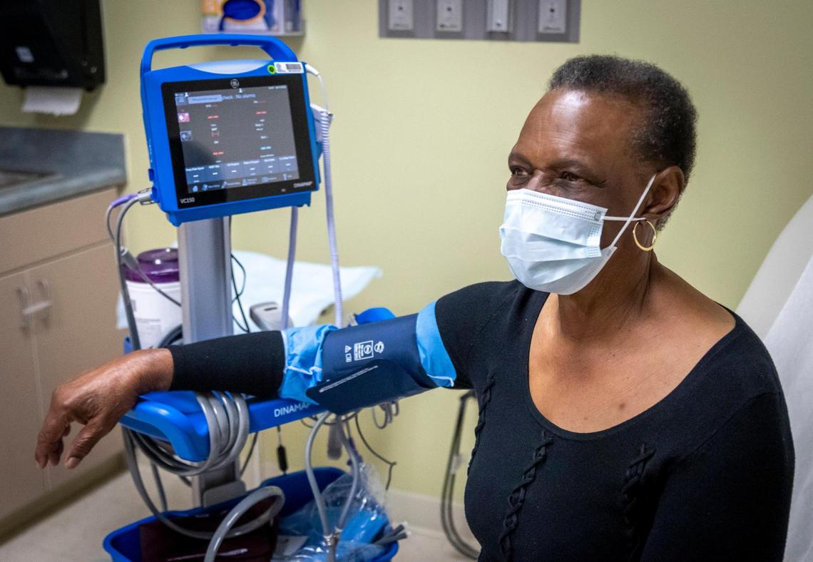 Fort Lauderdale, May 11, 2022 - Ernestine Turner has her blood pressure checked while visiting her physician, Dr. Scott Jordan, a gynecological oncologist at Broward Health Medical Center. She was diagnosed with cervical cancer when she was 72. Black women have higher mortality rates from cervical cancer compared with white women, often due to a late-stage diagnosis.