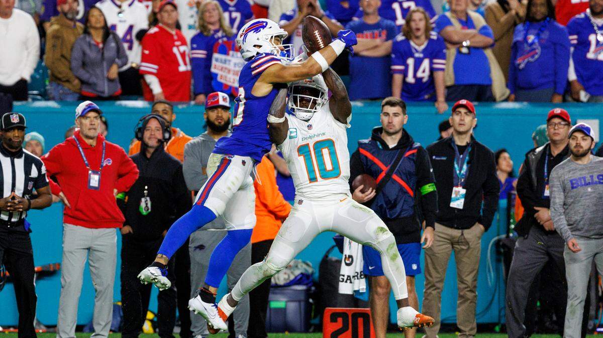 Buffalo Bills safety Taylor Rapp (20) breaks a pass intended to Miami Dolphins wide receiver Tyreek Hill (10) during second half of an NFL football game at Hard Rock Stadium on Sunday, Jan. 7, 2024 in Miami Gardens, Fl.