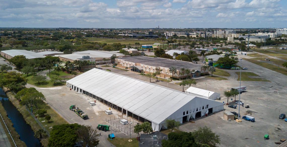 Construction crews assemble a 250-bed field hospital at Miami-Dade’s fairgrounds in Tamiami Park on March 24, 2020. The hospital was built in preparation for a surge of coronavirus cases that never materialized, and the facility was taken down this week.