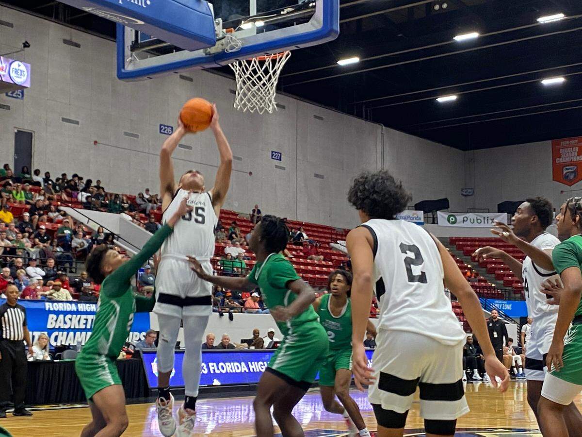 Riviera Prep guard Dante Allen goes up for a close range shot during the Bulldogs’ 68-67 victory over Tampa Catholic on Wednesday in a Class 3A state semifinal at the RP Funding Center in Lakeland, Fla.