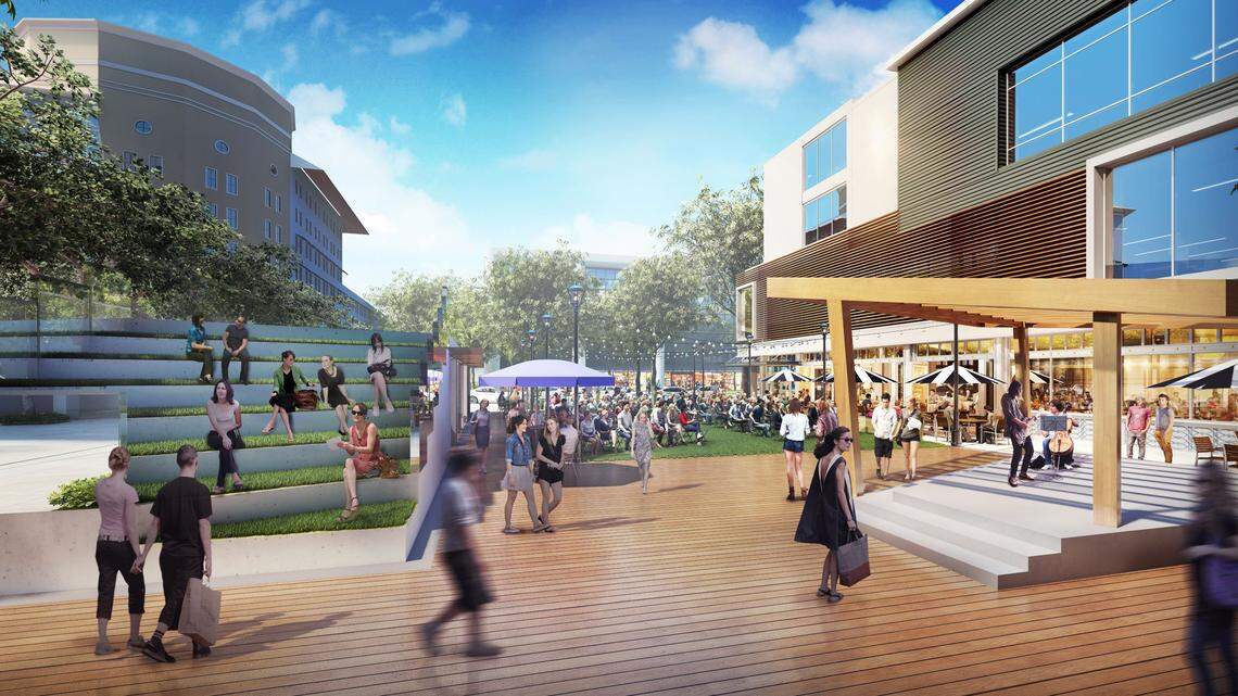 An architectural rendering of the redeveloped Shops at Sunset Place shows a band shell and grassy amphitheater seating for live performances at a planned new plaza opening to Red Road.