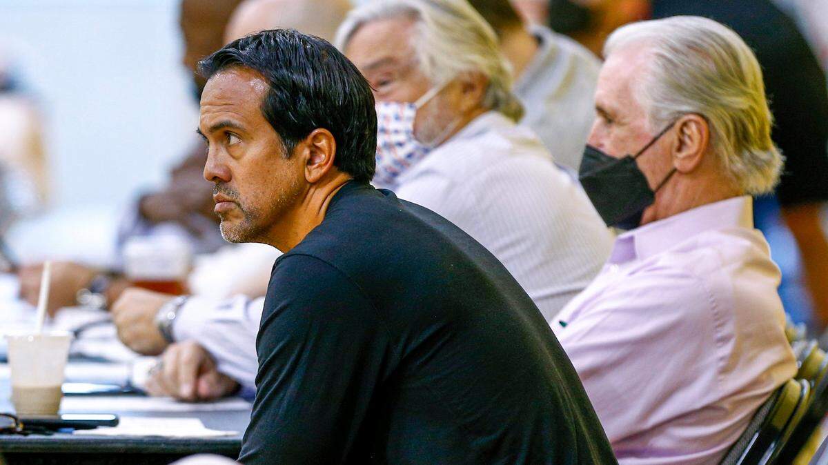 Miami Heat president Pat Riley, right, coach Erik Spoelstra, left, and owner Micky Arison, center, watch the team during a practice scrimmage for kids from the Jr. Heat program at FTX Arena in Miami on October 1, 2021.