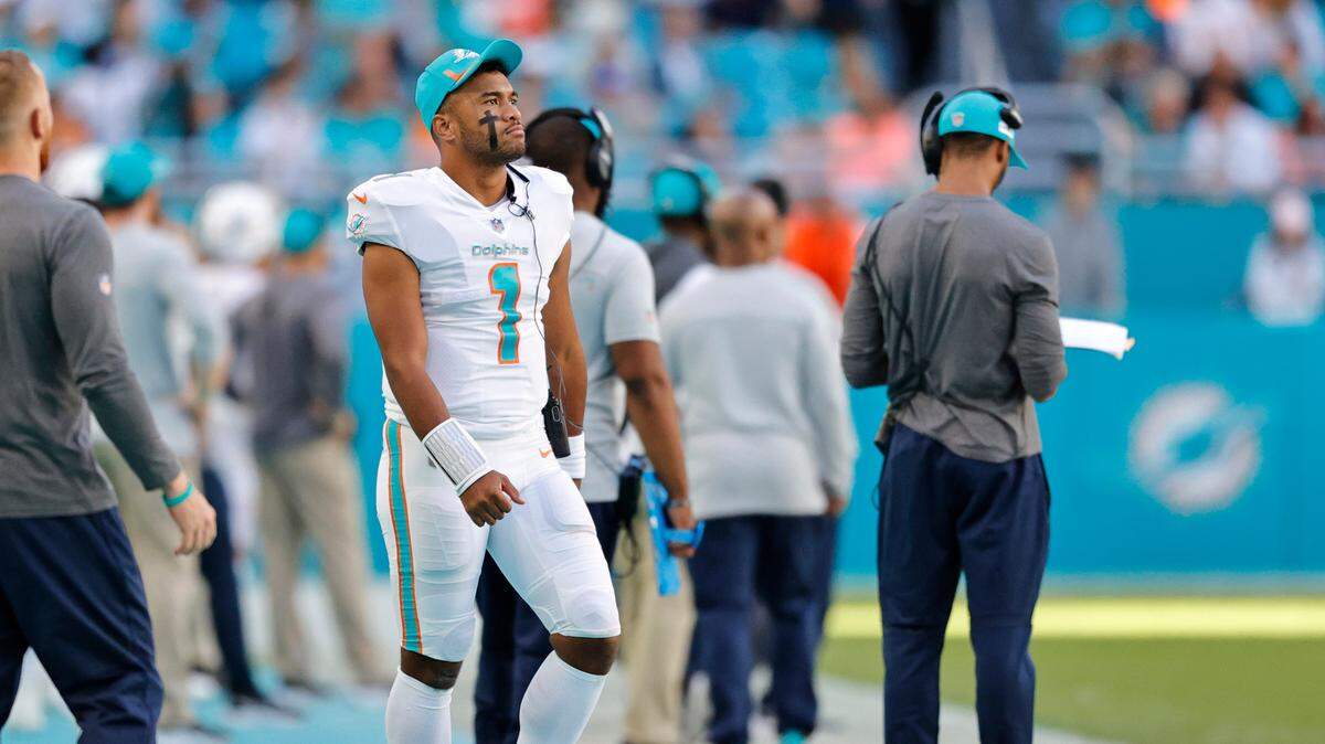 Miami Dolphins quarterback Tua Tagovailoa (1) looks from the sidelines during fourth quarter of an NFL football game against the Houston Texans at Hard Rock Stadium on Sunday, November 7, 2021 in Miami Gardens, Florida.