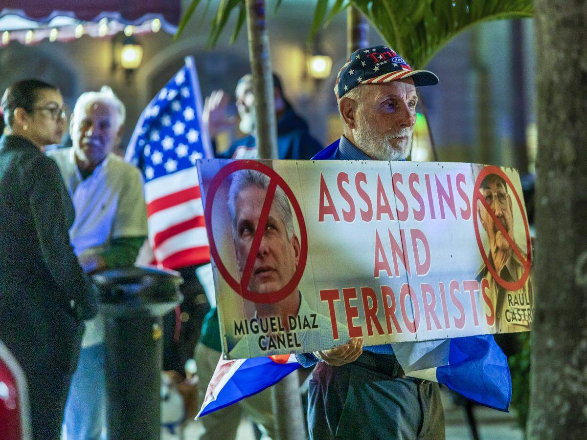 A group of Cuban exiles including Agustin Acosta, attended a vigil held at the iconic Versailles Cuban Cuisine Restaurant after four people were killed after a gunfire a day after a erupted between a Florida boat and the Cuban Coast Guard, at sea in Cuba, on Thursday, February 26, 2026.