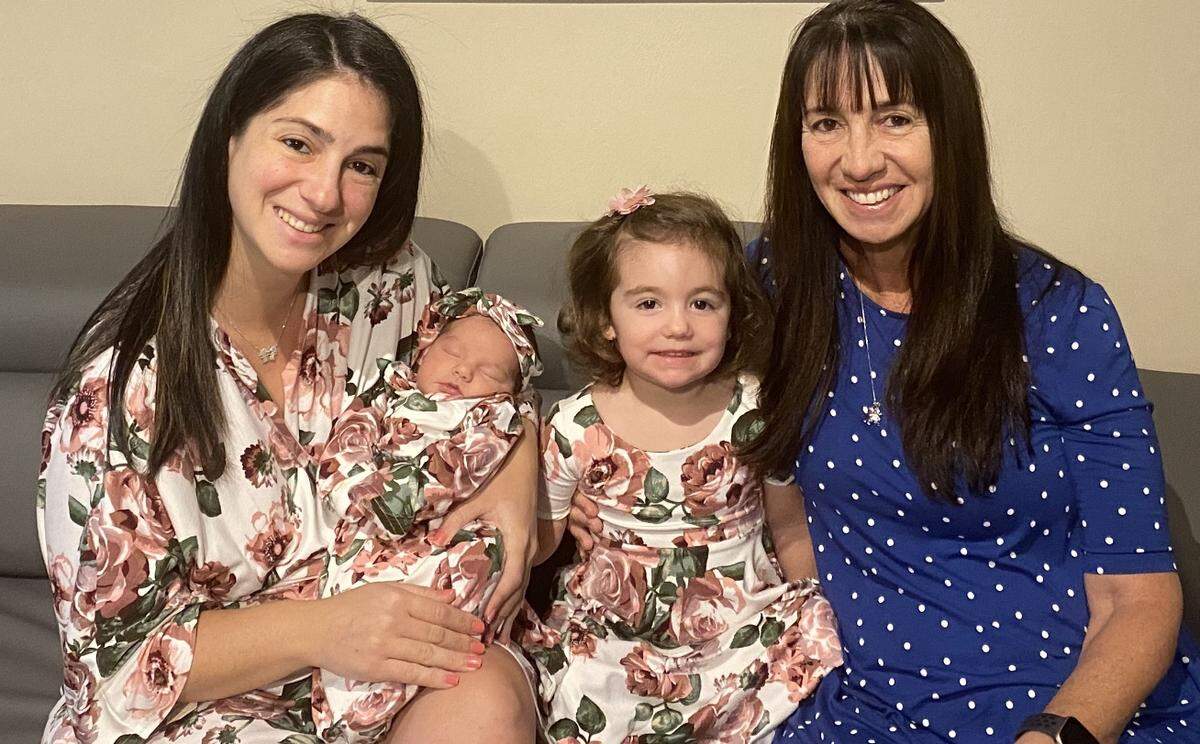 Jessica Steszewski, a Miami-Dade teacher, poses with her newborn Ava, her 2-year-old daughter Mia and her mother, Dori Delgado, a retired teacher.