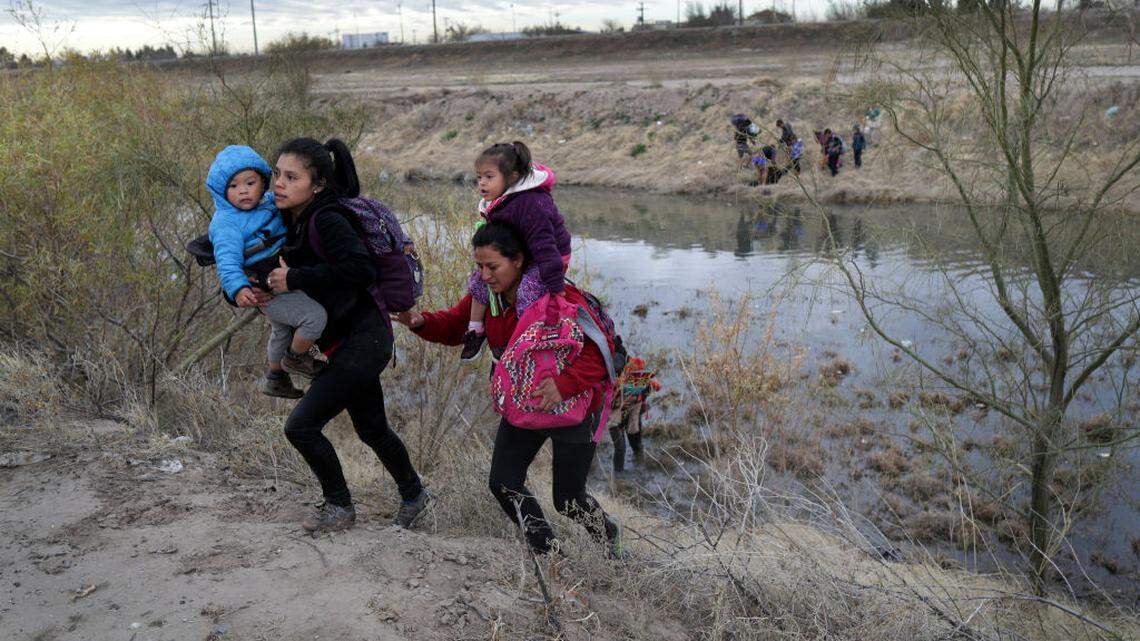 In February, Central Americans reach Texas after crossing the Rio Grande from Mexico. They later turned themselves in to U.S. Border Patrol agents, seeking political asylum.