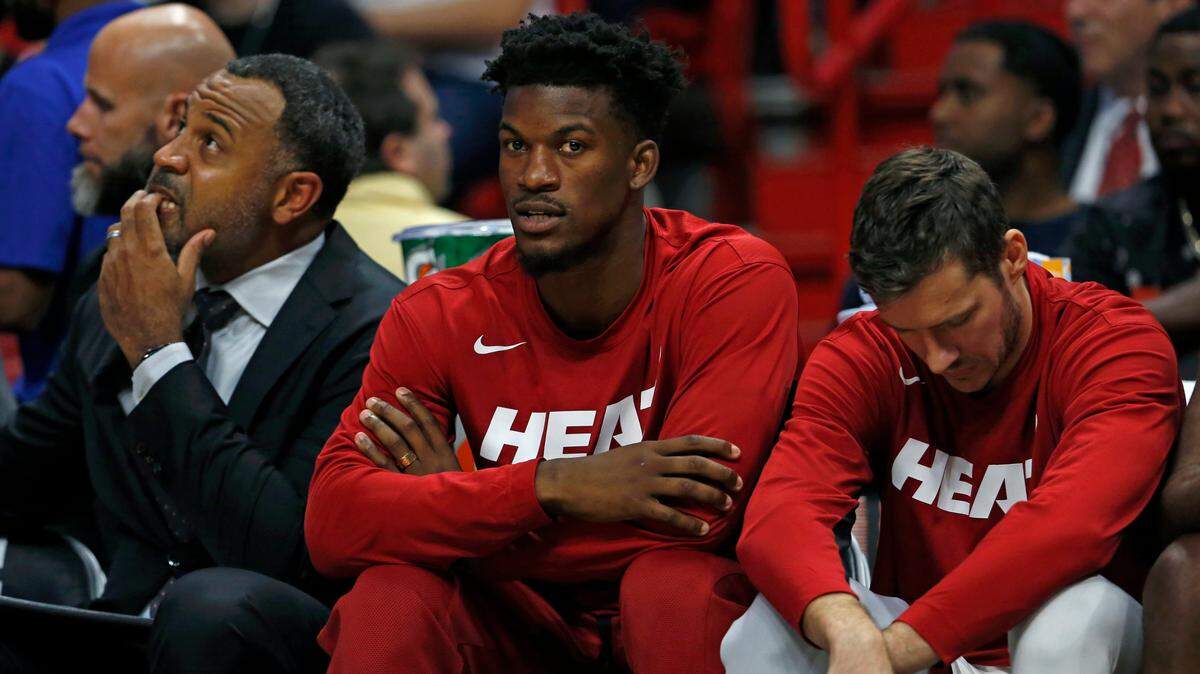 Miami Heat forward Jimmy Butler (22) looks from the bench in the first quarter of an NBA basketball preseason game against the Houston at the AmericanAirlines Arena on Friday, October 18, 2019 in Miami.