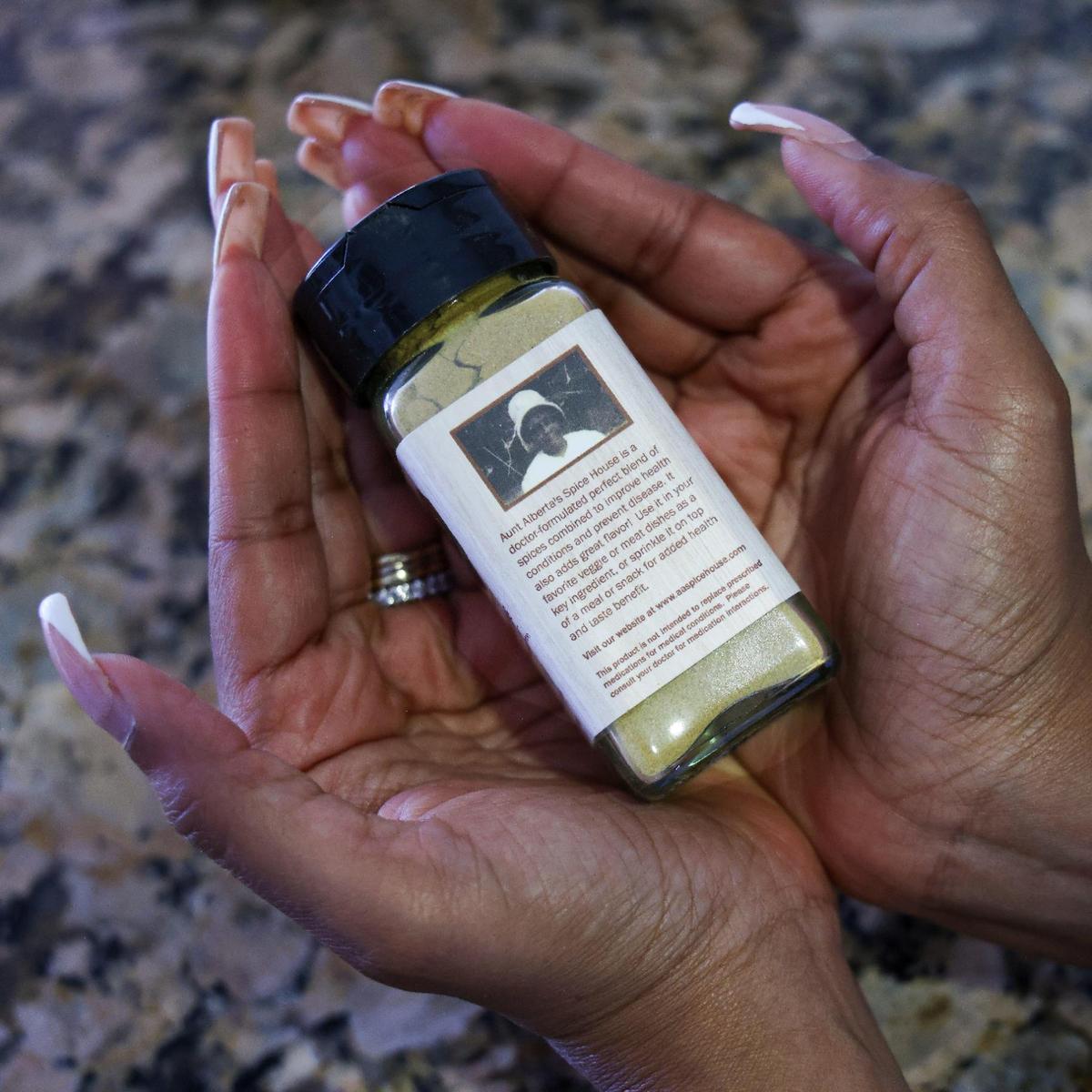 Dr. Venis Wilder, founder of Aunt Alberta’s Spice House, holds a bottle of her natural seasoning in Plantation, Florida, on Thursday, March 6, 2025.