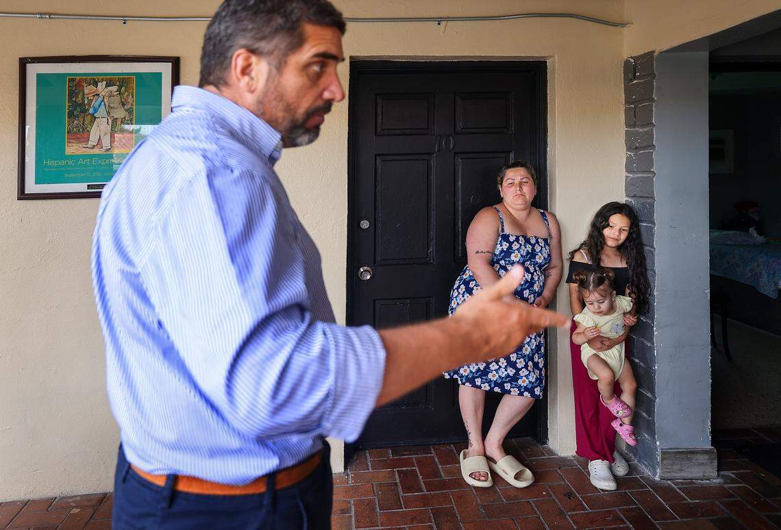 Yelitza Perez, 29, center, and her daughters, Paola, 9, right, and Itchel, 1, are currently staying at Ernesto Motel after an attempt to self-deport stalled when their travel documents were taken at the border several years ago while seeking asylum in the United States on Thursday, April 2, 2026, in Miami, Florida. Narciso Muñoz, the founder and president of Hermanos de la Calle (Brothers of the street), a nonprofit organization that helps the homeless in Miami, has helped Yelitza with a motel room and one hot meal every day for over three weeks as she navigates her situation and tries to get back home to Venezuela.