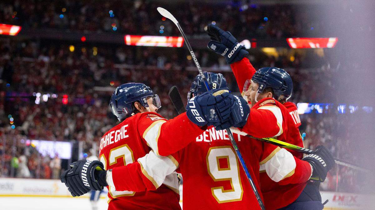 Florida Panthers center Sam Bennett (9) celebrates his goal with center Carter Verhaeghe (23) and left wing Matthew Tkachuk (19) during the third period of Game 4 of a Stanley Cup playoffs second-round series against the Toronto Maple Leafs on Sunday, May 11, 2025, at Amerant Bank Arena in Sunrise, Fla. The Florida Panthers won 2-0.