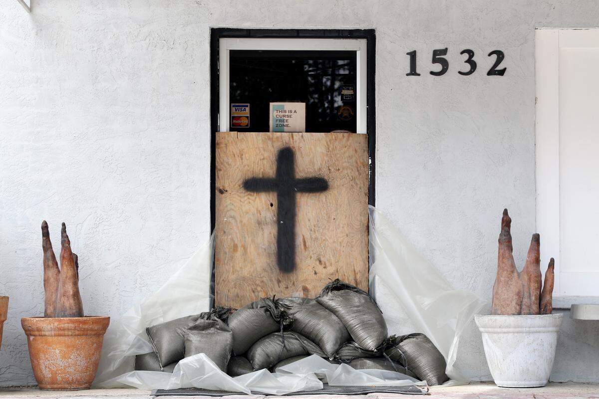 The front door of the business office for Brooks Concrete is sandbagged in downtown Panacea on Tuesday as Hurricane Michael churns toward the Florida Panhandle.