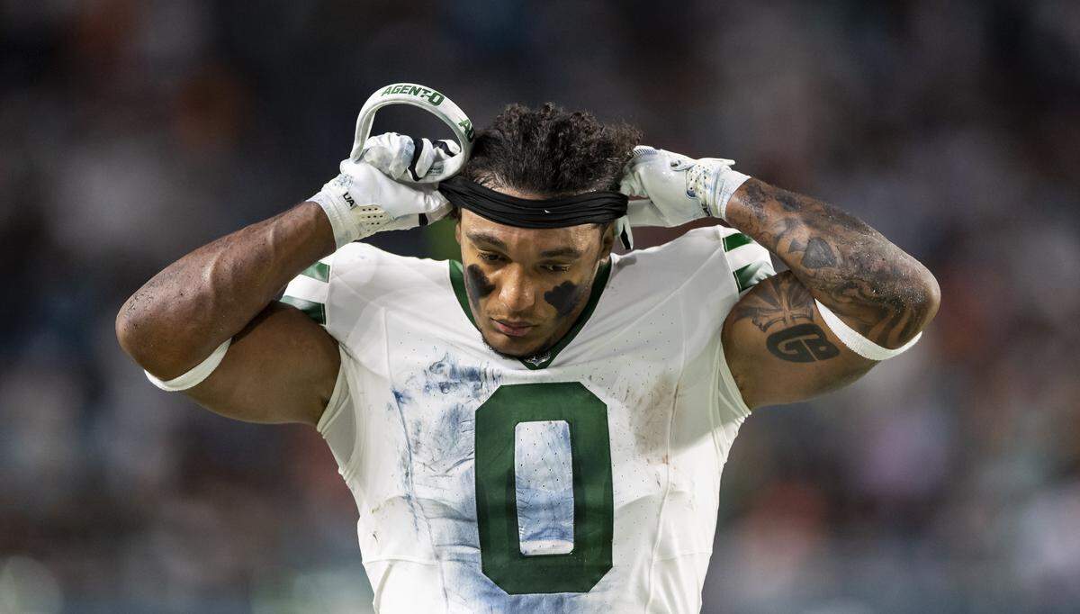 New York Jets running back Braelon Allen (0) reacts after fumbling the ball against the Miami Dolphins in the first half of their NFL game at Hard Rock Stadium on Monday, Sept. 29, 2025, in Miami Gardens, Fla.
