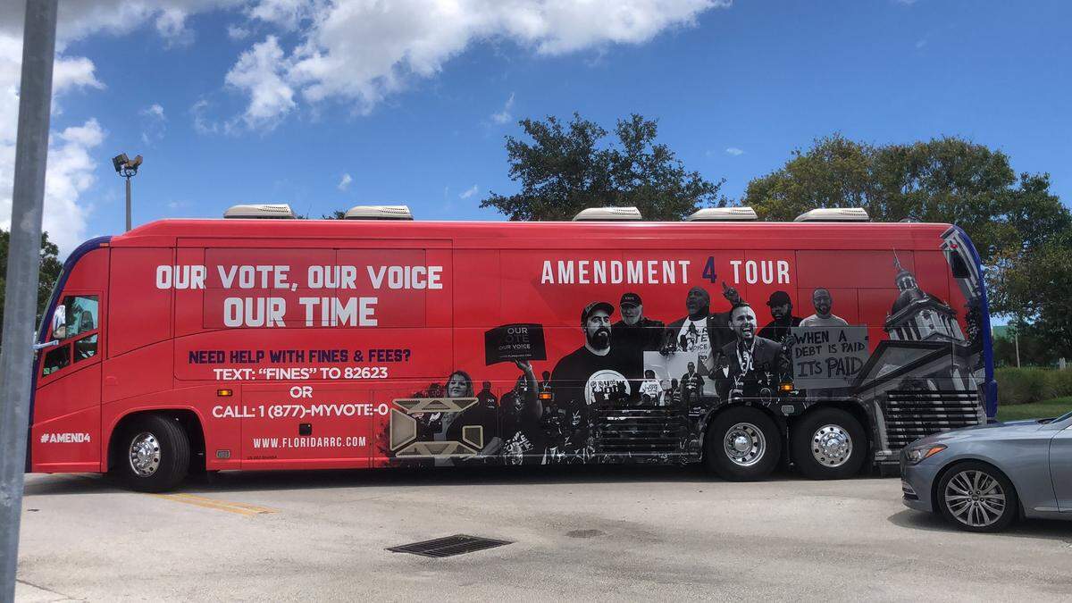 The Florida Rights Restoration Coalition bus leads the “Souls to the Polls” parade to the North Dade Library.