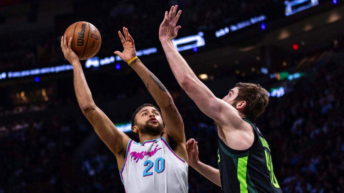 Miami Heat forward Kyle Anderson (20) shoots over Boston Celtics center Luke Kornet (40) during the first half of an NBA game at Kaseya Center on February 10, 2025, in Miami.