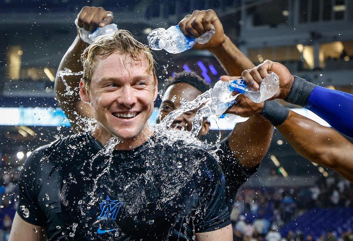 Miami Marlins teammates shower Kyle Stowers (28) aft3er the game after hitting a home run on a fly ball to right field bringing in Javier Sanoja (46) to score in the 10th inning against the Kansas City Royals at loanDepot park in Miami, Florida, on Friday, July 18, 2025.