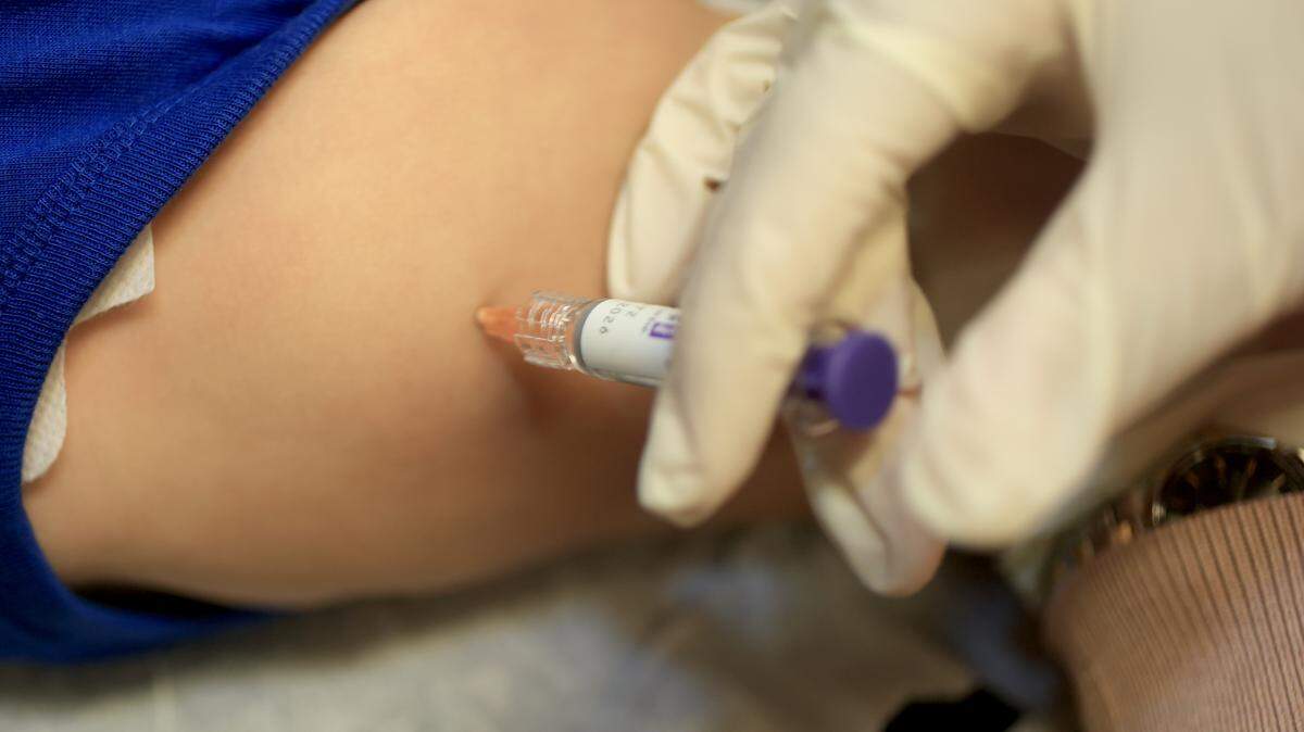 A baby receives a standard immunization at Doctor Gary M. Kramer, MD, PA's Pediatric office on September 12, 2025, in Coral Gables, Florida. The Florida Department of Health recently released information on the development of rulemaking to revise immunization and document requirements for school entry. (Photo by Joe Raedle/Getty Images)