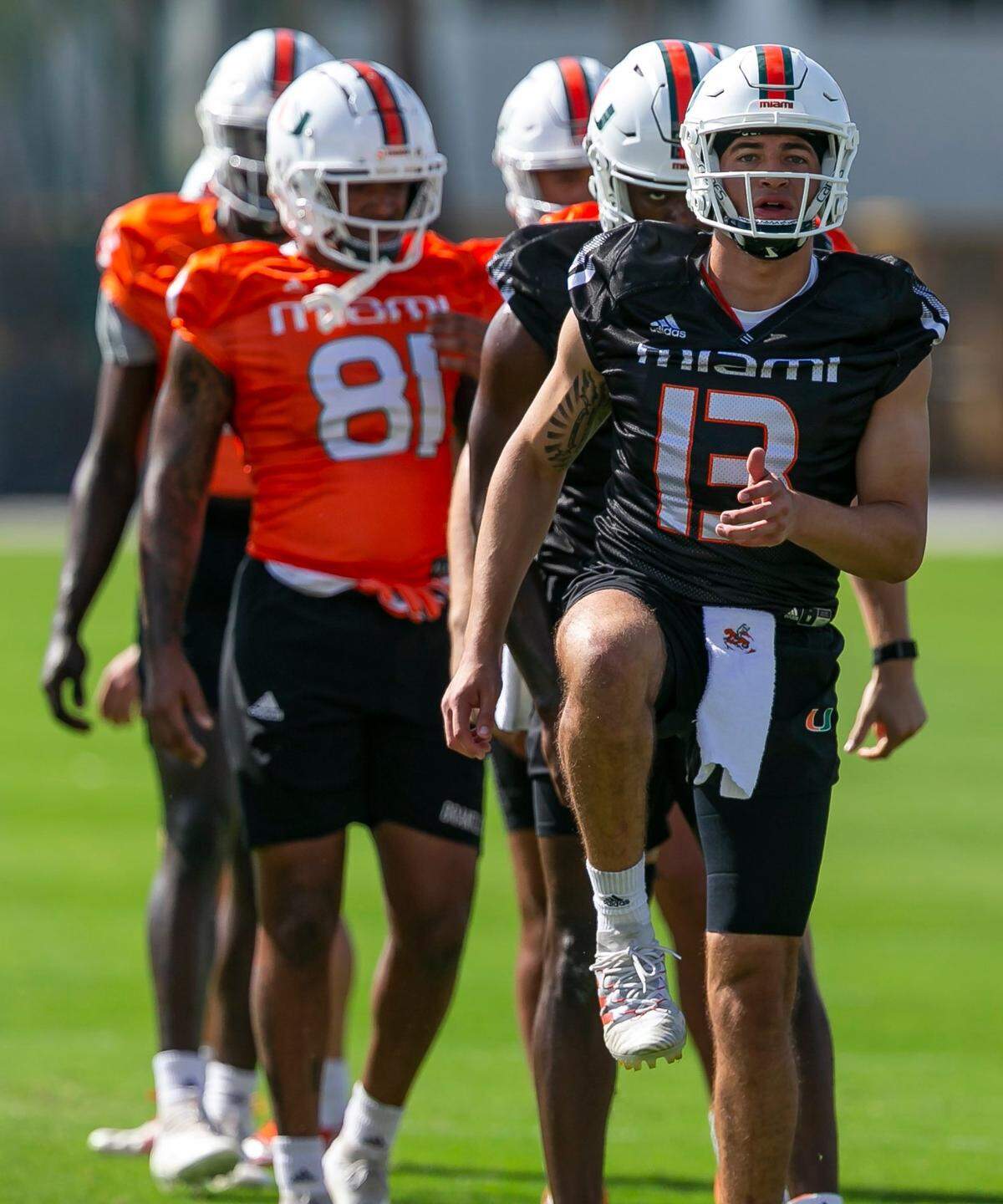 Miami Hurricanes quarterback Jake Garcia (13) runs practice drills with his team at the University of Miamis Greentree Practice Fields in Coral Gables, Florida on Monday, March 7, 2022.