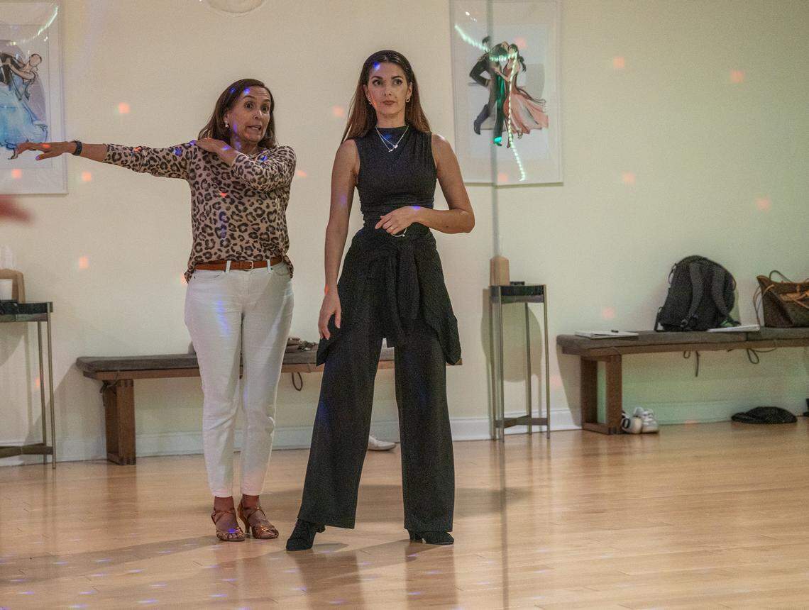 Dance instructor Daniela Vacaru demonstrates to student Cecilia Calderon during a class at Let's Dance Miami studio in Aventura, on Wednesday, February 18, 2026.