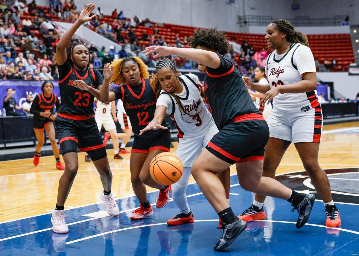 Southridge High School’s Emily Jean-Glaude (3) battles Bloomingdale defenders in the second half of FHSAA Class 6A Girls High School Basketball State Championship.