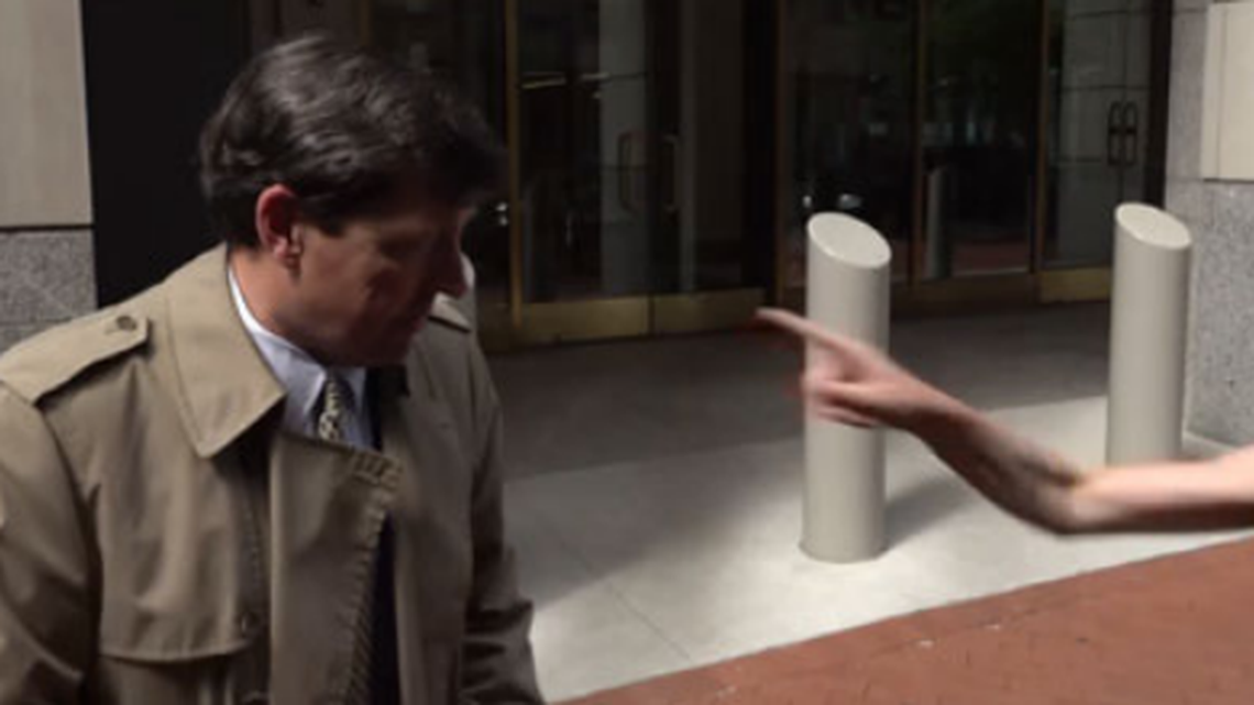 A Washington, D.C., woman is accused of assaulting former interim U.S. Attorney Edward R. Martin Jr. by spitting on him during a news interview on May 8.