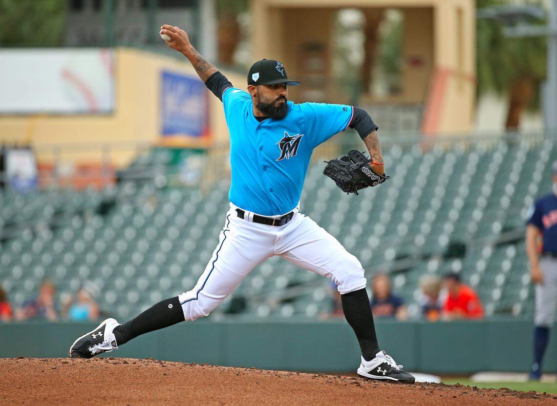 Miami Marlins pitcher Sergio Romo (54) pitches uring the third inning of a Major League Baseball spring training game against the Houston Astros at Roger Dean Chevrolet Stadium on Tuesday, February 26, 2019 in Jupiter, FL .