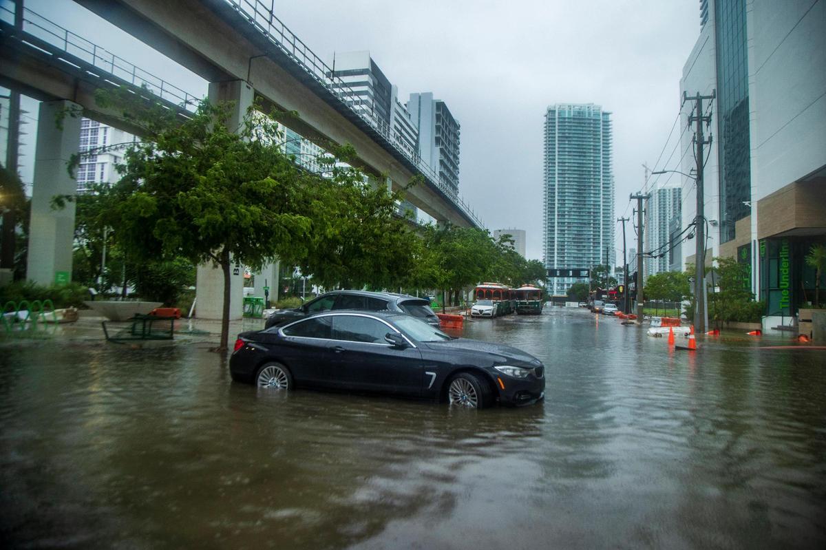 Massive rainfall from the hurricane season’s first disturbance caused floods, stranding cars and soaking businesses Saturday morning in the Brickell area near downtown Miami on June 4, 2022.